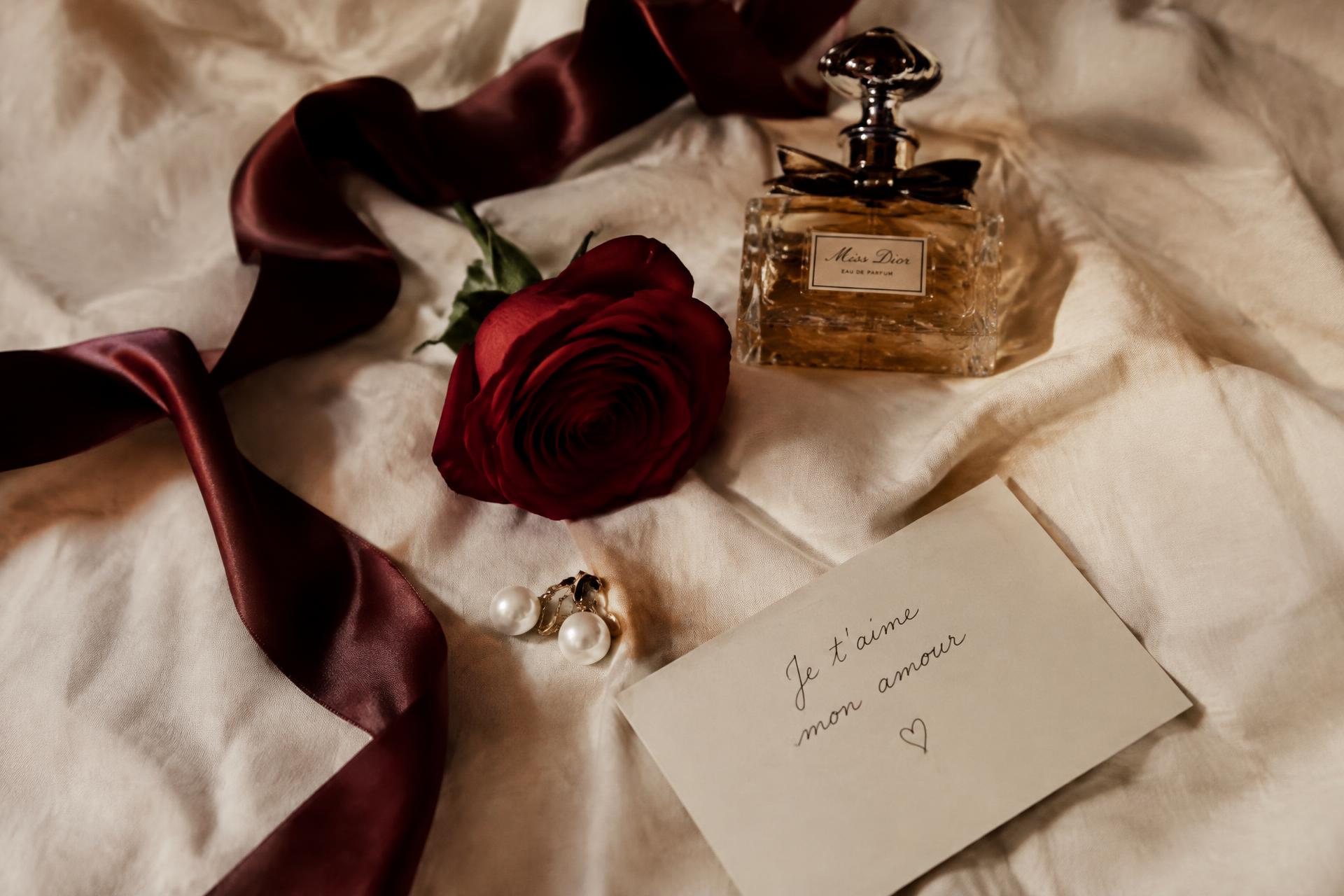 Silk ribbon, a red rose, pearls and a love note
